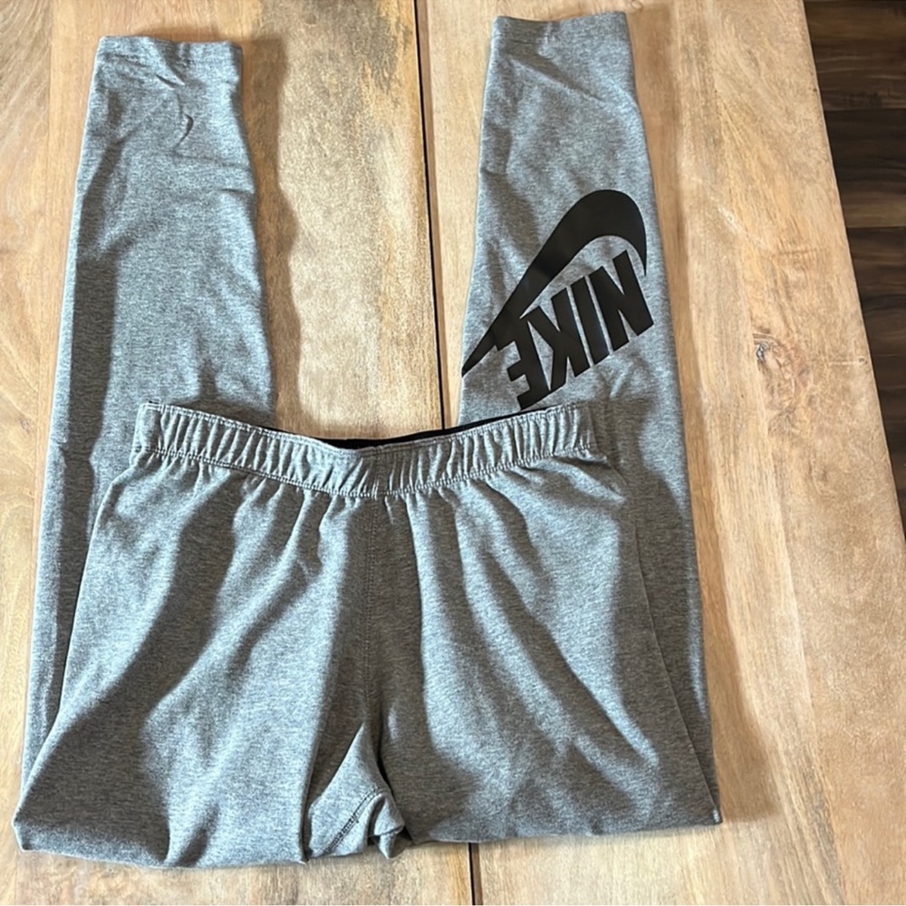 Nike gray leggings. Logo on back of leg in black. Sz. Medium